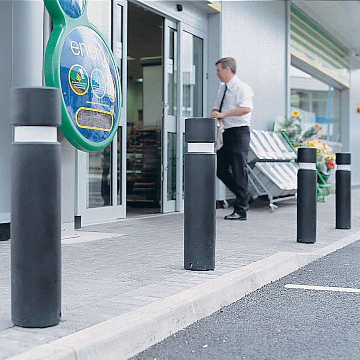 plastic bollards in front of shop