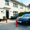serviced red telescopic bollards on driveway