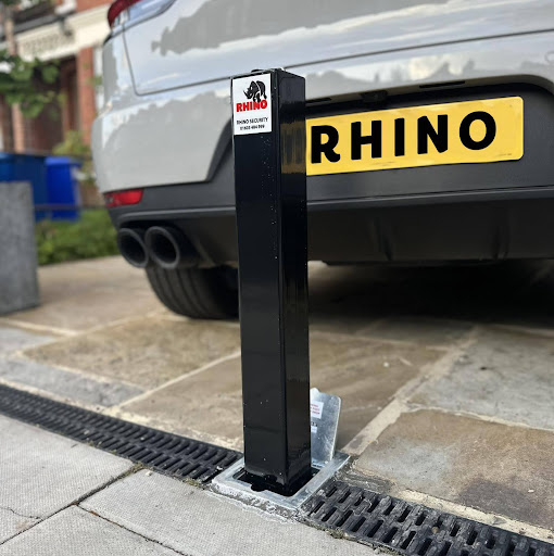 Rhino security bollard at end of driveway with close of up car behind it