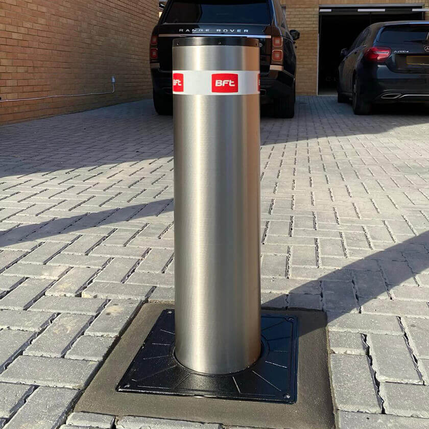 Thick steel bollard at end of driveway