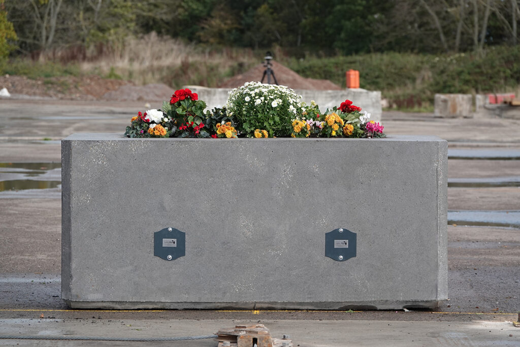 Planter bollard with flowers