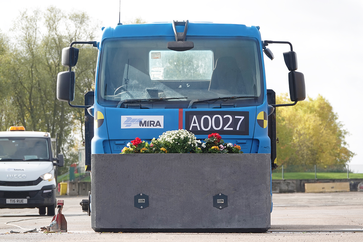 Lorry behind planter bollard