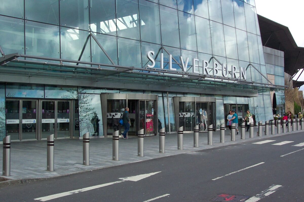 Bollards outside glass building