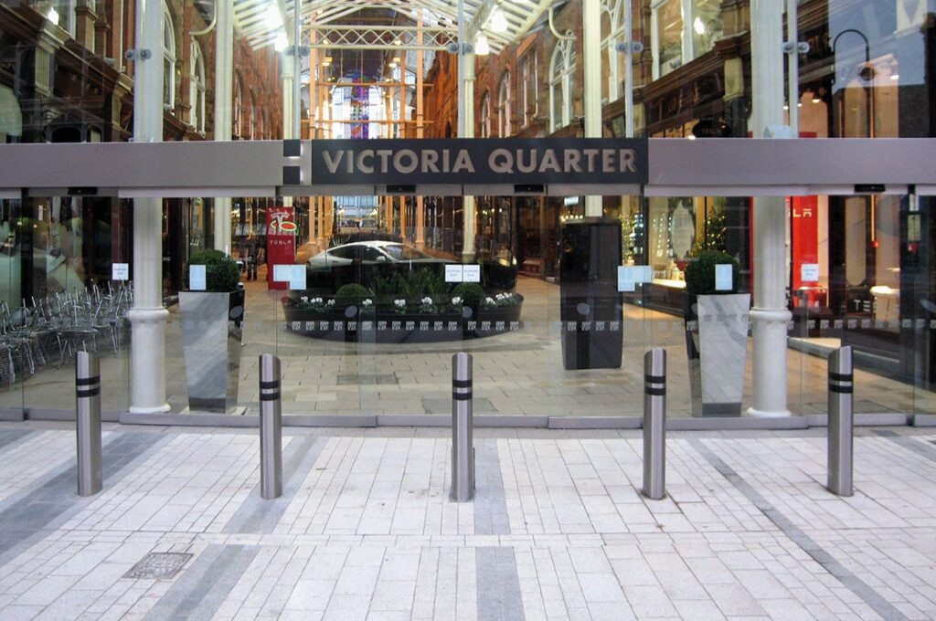 Bollards protecting a big glass shop window