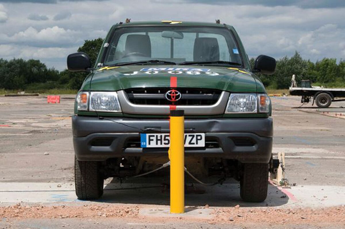 Truckstopper bollard with truck behind it